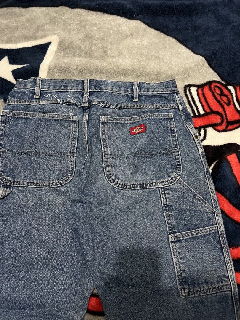 Dickies Carpenter Denim Jeans Blue (Category: Jeans) located in Tanza. Submitted by 1954_street (Listing ID 1470376776, Image 2). Description: DICKIES CARPENTER PANTS 32 waist 40 length 9 leg op cut parts on hem 800 - Brand/Style: Dickies denim carpenter jeans in a classic blue wash - Fit: Straight leg - Features: Utility side pockets and attached hammer loop - Details: Distressed fraying at the back waistband and bottom hems - Material: Durable 