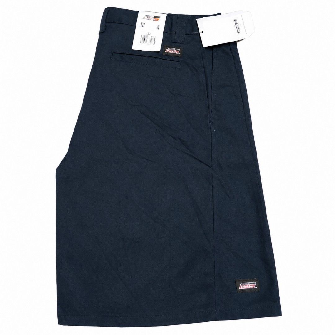 Dickies Navy Blue Shorts Size 34 (Category: Shorts) located in Manila. Submitted by aj.bermundo (Listing ID 1470358063, Image 1). Description: - Brand: Dickies - Color: Dark Navy Blue - Size: 34 Waist - Material: 65% Polyester, 35% Cotton blend - Features: Standard button closure, belt loops, side pockets, and rear welt pockets - Details: Woven Dickies logo patch on left leg hem and above back pocket - Condition: Brand new with original retail ta