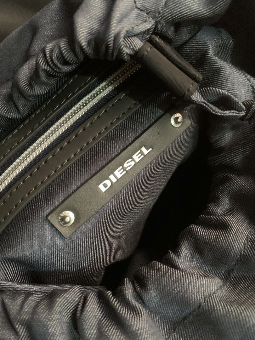 Diesel 2010’s Y2k Archival Backpack (Category: Luxury Bags & Wallets) located in Manila. Submitted by kwentoatkasuotan (Listing ID 1470469883, Image 2). Description: Diesel 2010s Nylon & Denim Detail Mini Backpack This piece is a contemporary utilitarian mini backpack produced by Italian denim and streetwear label Diesel. Constructed primarily from durable black nylon, it incorporates distinctive Diesel heritage details such as denim-trimmed zipp
