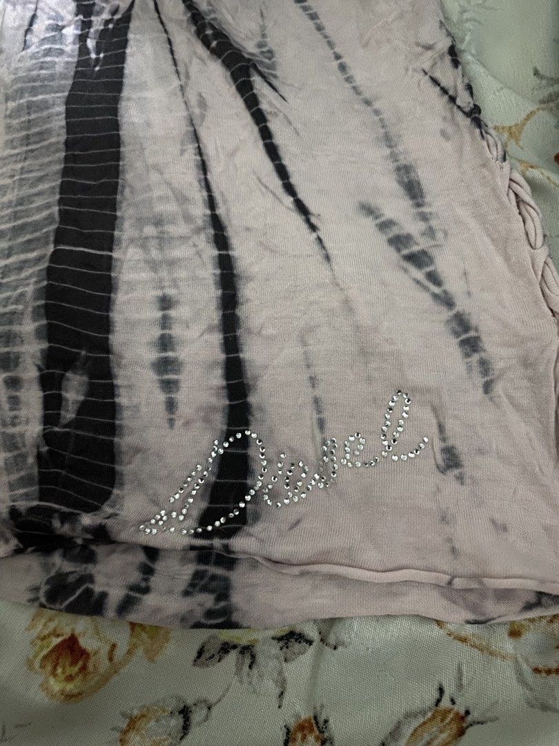 Diesel Reworked Tank Top (with tags) (Category: Sleeveless) located in Marikina City. Submitted by bebeplumm (Listing ID 1470501372, Image 2). Description: No issues just a sign of usage Authentic Still negotiable DM FOR MORE INFO.