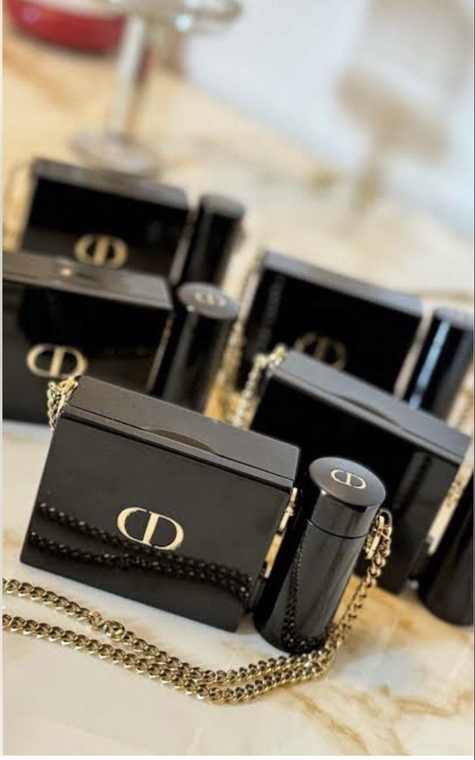 Dior lipstick clutch set (Category: Makeup) located in Caloocan City. Submitted by thylina_west24 (Listing ID 1470360154, Image 2). Description: ✨ DIOR Rouge Dior Minaudière Lipstick & Clutch Set ✨ Luxury meets beauty! 💄💋 This elegant gold Dior clutch comes with 4 gorgeous lipstick shades, perfect for every occasion. Features a detachable chain strap, making it a chic mini bag and a luxurious makeup collectible. Perfect for gifting or treating 