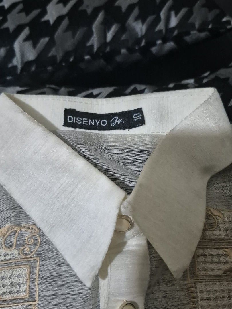 Disenyo Jr. Barong Tagalog (Category: Formal Shirts) located in Quezon City. Submitted by kctheexplorer05 (Listing ID 1470533121, Image 3). Description: Disenyo Jr. Barong Tagalog from Robinsons Department Store. Traditional long-sleeve formal wear. Detailed embroidery panels down the front. Classic pointed collar, button placket, and button cuffs. Cream-colored sheer fabric. Original tags still attached with retail price of P899.00. Size 10 tag 