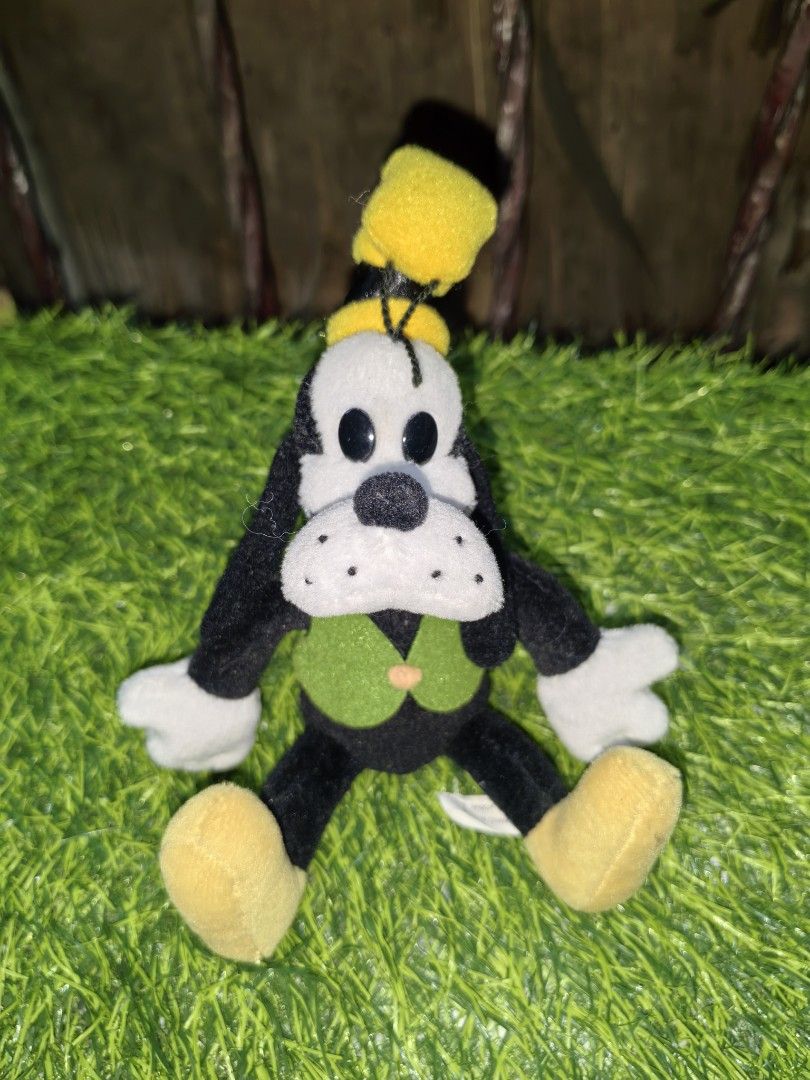 Disney Goofy Plush Toy (Category: Plushies & Soft Toys) located in Paranaque City. Submitted by furugiyafinds (Listing ID 1470457480, Image 1). Description: - Official Disney Goofy plush toy with authentic Disney Enterprises Inc. back tag - Classic outfit featuring a green vest, yellow hat, white gloves, and yellow shoes - Made with ultra-soft and cuddly fabric material - Designed in a cute, stable sitting pose - Great addition to any Disney coll