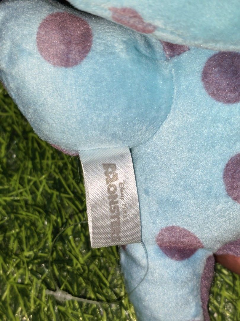 Disney Pixar Monsters Sulley Plush Keychain (Category: Plushies & Soft Toys) located in Paranaque City. Submitted by furugiyafinds (Listing ID 1470457035, Image 3). Description: - Authentic Disney Pixar Monsters character plush keychain - Features soft blue fabric with iconic purple spots and cute little horns - Equipped with a sturdy plastic clip at the back for easy hanging - Palm-sized, approximately compact and lightweight - Condition: Excell
