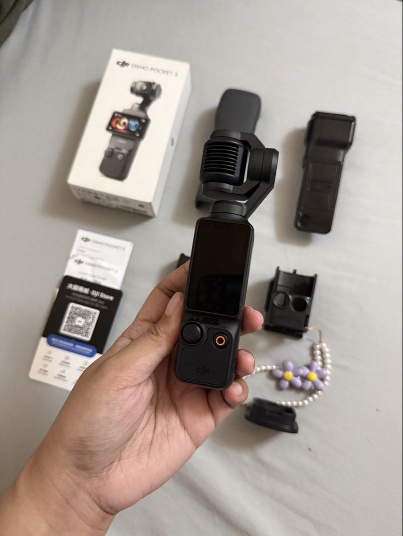 DJI Osmo Pocket 3 Vlogging Camera (Category: Cameras) located in Quezon City. Submitted by deniseuntalan (Listing ID 1470457543, Image 1). Description: - Selling for a friend - Complete DJI Osmo Pocket 3 bought from Japan - Includes original box, protective case, and handle grip - Free accessories: 2 types of magnetic strap mount (easy release & caged), stand and case - Includes printed manuals - RFS: Will upgrade to DJI Action 6 - Meet-up only (