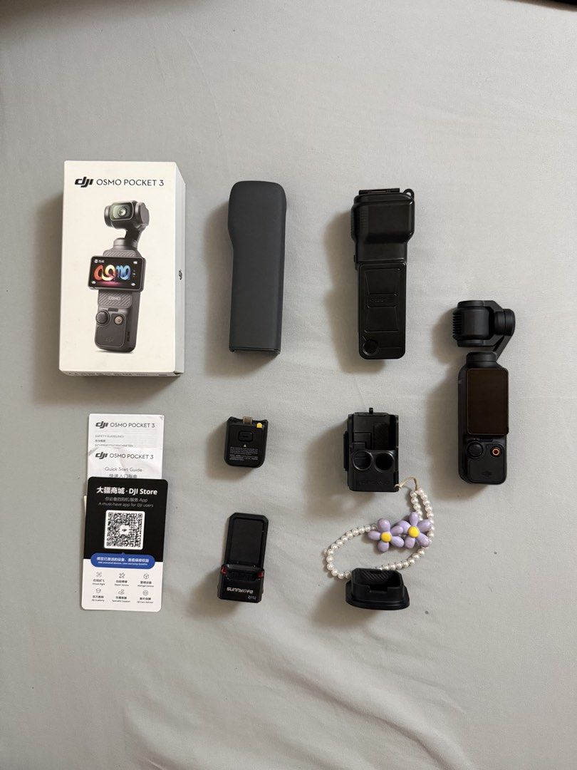 DJI Osmo Pocket 3 Vlogging Camera (Category: Cameras) located in Quezon City. Submitted by deniseuntalan (Listing ID 1470457543, Image 2). Description: - Selling for a friend - Complete DJI Osmo Pocket 3 bought from Japan - Includes original box, protective case, and handle grip - Free accessories: 2 types of magnetic strap mount (easy release & caged), stand and case - Includes printed manuals - RFS: Will upgrade to DJI Action 6 - Meet-up only (