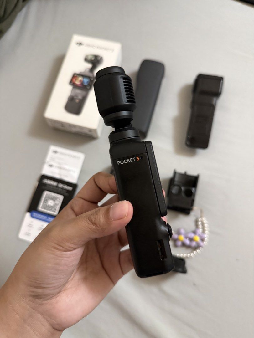 DJI Osmo Pocket 3 Vlogging Camera (Category: Cameras) located in Quezon City. Submitted by deniseuntalan (Listing ID 1470457543, Image 3). Description: - Selling for a friend - Complete DJI Osmo Pocket 3 bought from Japan - Includes original box, protective case, and handle grip - Free accessories: 2 types of magnetic strap mount (easy release & caged), stand and case - Includes printed manuals - RFS: Will upgrade to DJI Action 6 - Meet-up only (