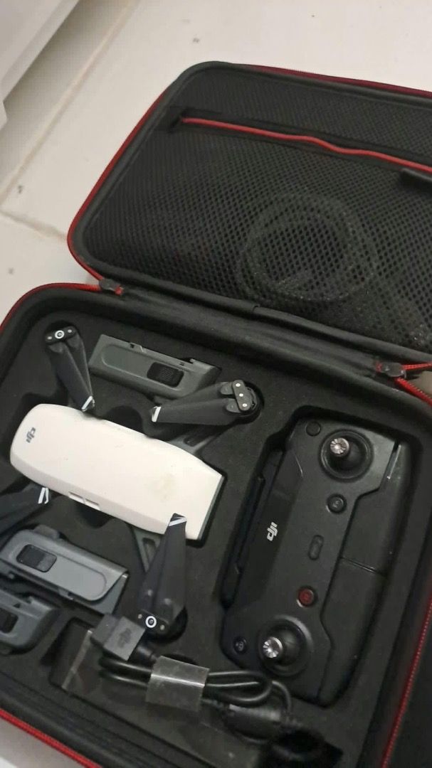 DJI Spark Fly More Combo Drone (Category: Drones) located in Caloocan City. Submitted by omlpolicar58626 (Listing ID 1470376974, Image 3). Description: - Item: DJI Spark Fly More Combo (White with Blue Decal) - Condition: Excellent, complete package - Includes: Drone body, remote controller, multiple batteries, power adapter, and cables - Storage: Custom foam-fitted hard carrying case for ultimate portability - Perfect for travel and beginner to 