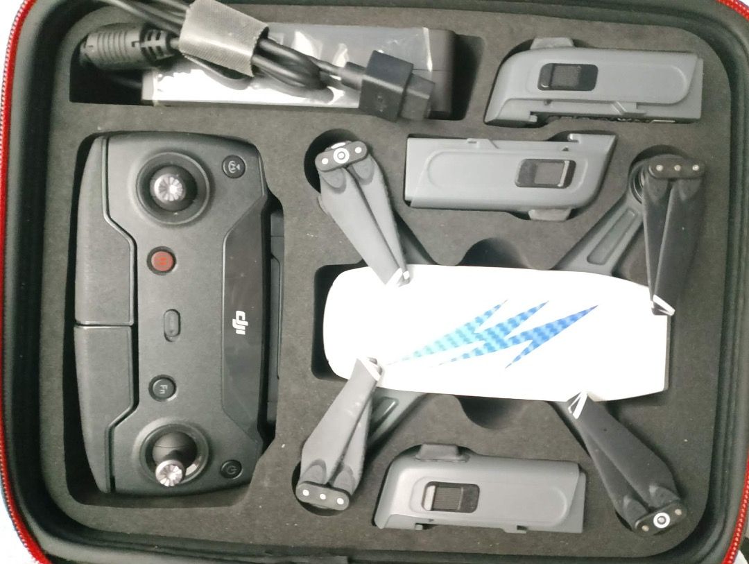 DJI Spark Fly More Combo Drone (Category: Drones) located in Caloocan City. Submitted by omlpolicar58626 (Listing ID 1470376974, Image 1). Description: - Item: DJI Spark Fly More Combo (White with Blue Decal) - Condition: Excellent, complete package - Includes: Drone body, remote controller, multiple batteries, power adapter, and cables - Storage: Custom foam-fitted hard carrying case for ultimate portability - Perfect for travel and beginner to 