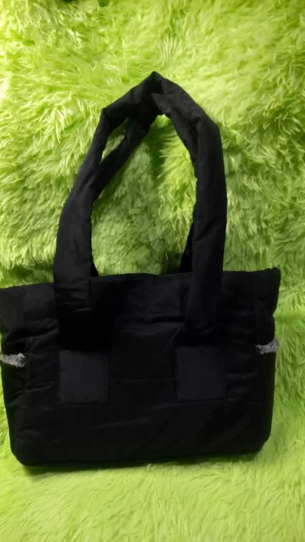 Dog Tote Bag Black (Category: Tote Bags) located in Manila. Submitted by twinklelyn03 (Listing ID 1470414820, Image 3). Description: - Authentic Louis Dog Viva Tote Bag in sleek black - Cozy grey faux fur lining keeps your pet warm and comfortable - Chic puffer design with a soft, cushioned structure - Comfortable shoulder handles for easy carrying - Perfect for stylish small dogs and pets on the go see photos for details pm sa sure buyer only ma