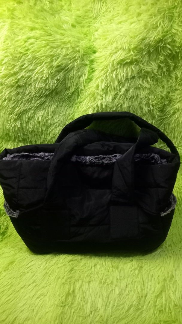 Dog Tote Bag Black (Category: Tote Bags) located in Manila. Submitted by twinklelyn03 (Listing ID 1470414820, Image 2). Description: - Authentic Louis Dog Viva Tote Bag in sleek black - Cozy grey faux fur lining keeps your pet warm and comfortable - Chic puffer design with a soft, cushioned structure - Comfortable shoulder handles for easy carrying - Perfect for stylish small dogs and pets on the go see photos for details pm sa sure buyer only ma