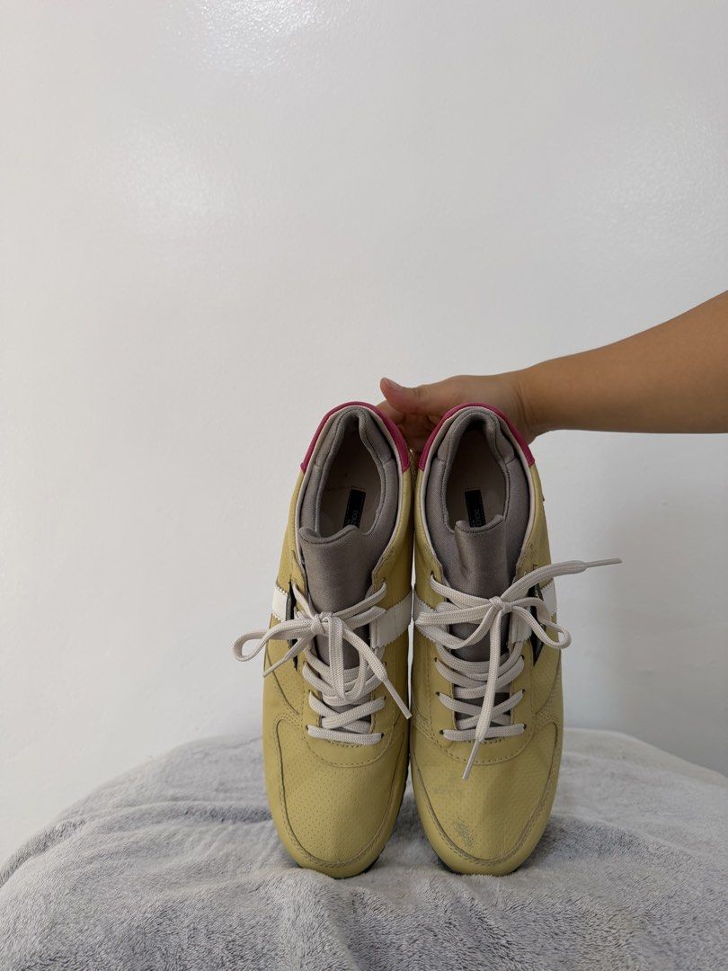 Dolce & Gabbana Multicolor Leather Sneakers (Category: Sneakers & Footwear) located in Manila. Submitted by escarchame98247 (Listing ID 1470490237, Image 1). Description: Dolce & Gabbana designer sneakers in yellow leather with pink, gold, and white panels. Black and white cow print detail along the midsole. Navy blue ridged rubber outsole with embossed branding. White laces and padded grey tongue with brand label. Bold colorblock design combinin