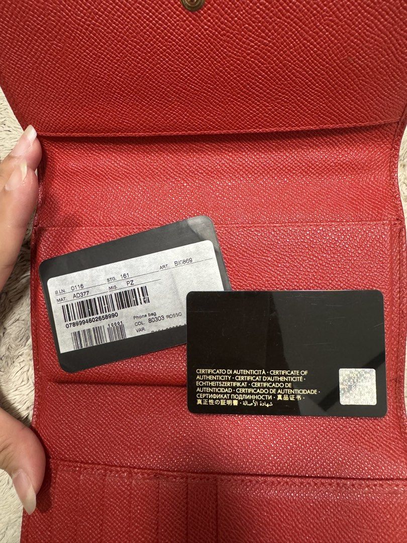 Dolce & Gabbana Purse (Category: Purses & Pouches) located in Antipolo. Submitted by nathshn_ (Listing ID 1470402109, Image 3). Description: Authentic Dolce & Gabbana red textured leather bag with stunning floral crystal embellishments and gold hardware. Features a structured top handle, flap snap closure, and interior card slots. Comes complete with authenticity card. Perfect statement piece for any outfit! Does not come with the original strap 