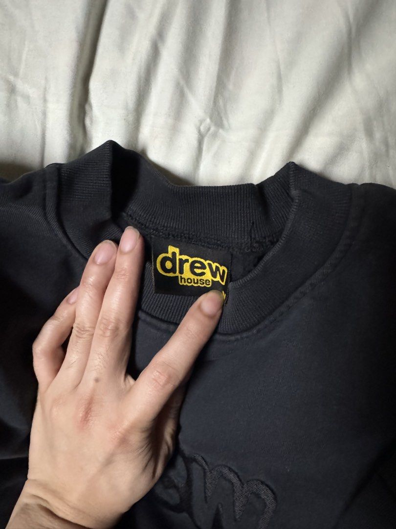 drew house black embroidered sweatshirt medium (Category: Coats, Jackets and Outerwear) located in Manila. Submitted by seangoart (Listing ID 1470350312, Image 2). Description: - Brand: Drew House - Item: Crewneck Sweatshirt - Color: Black with dark grey & black embroidered chest logo - Size: Medium (Classic streetwear fit) - Material: Heavyweight cotton with ribbed cuffs and hem - Condition: Authentic with original neck tag included.