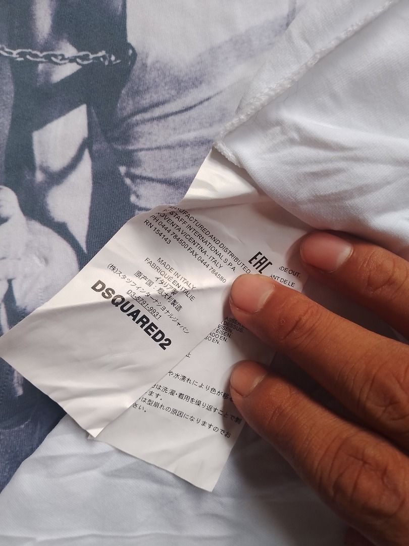 DSquared2 Bruce Lee Graphic T-Shirt (Category: Tshirts & Polo Shirts ) located in Caloocan City. Submitted by alfepangasate1021 (Listing ID 1470402700, Image 3). Description: - Brand: Dsquared2 (Distributed by Staff International) - Color: White - Design: Large front graphic print of Bruce Lee with nunchucks - Style: Classic crew neck, short sleeves - Origin: Made in Italy - Condition: Clean, well-maintained piece with crisp graphics.