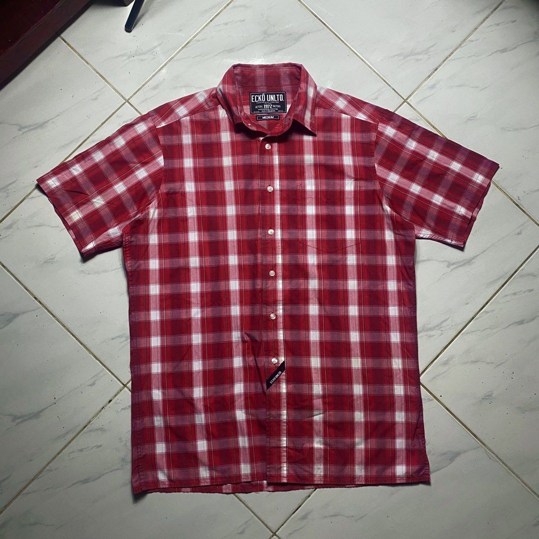 Ecko Unltd Red Plaid Short Sleeve Button Up Shirt Medium (Category: Tshirts & Polo Shirts ) located in Camiling. Submitted by camthrift_2024 (Listing ID 1470395899, Image 2). Description: ECKO UNLTD OVERSIZED POLO (y2k style) XL 24x31.5 COLOR RATE: 10/10 ISSUE:❌❌❌ ₱350 PEDE VC SA JNT SHIP NOW OPEN FOR TERMS UNLI VOUCH GCASH JNT CAMILING, TARLAC📌 - Brand: Ecko Unltd - Style: Short sleeve button-up shirt - Pattern: Red and white plaid - Size: Medi