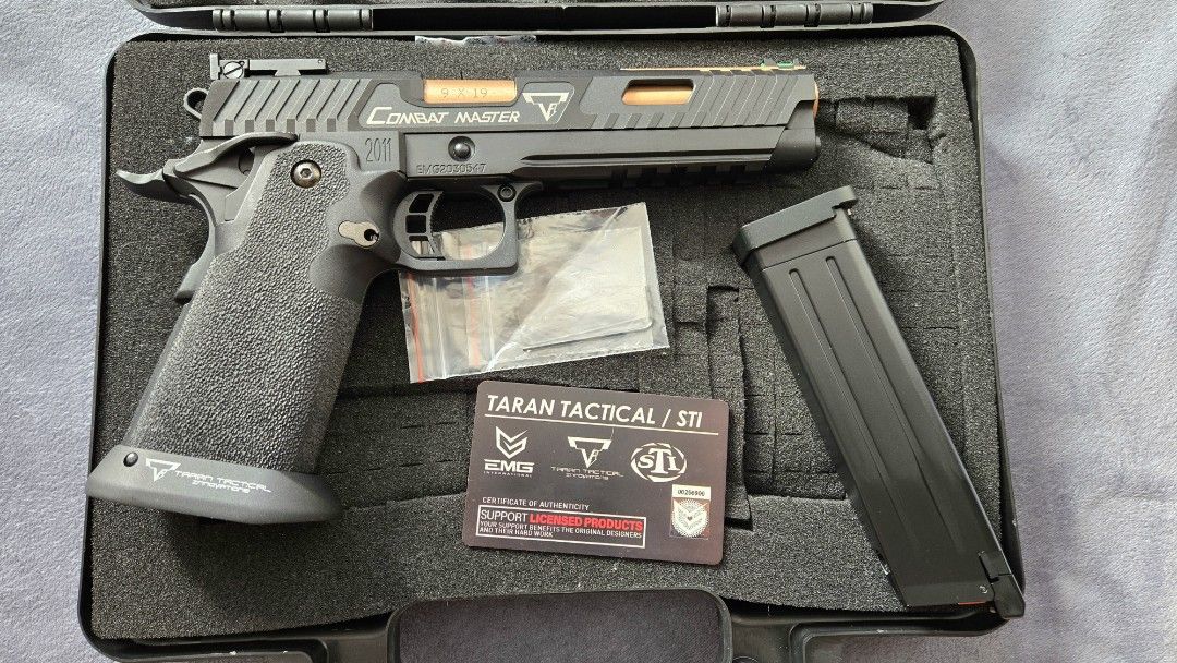 EMG Taran Tactical STI Combat Master 2011 JW3 (Category: Combat Sports) located in Calamba. Submitted by black2018 (Listing ID 1470557269, Image 2). Description: - Model: EMG Taran Tactical STI Combat Master 2011 Airsoft Pistol - Color/Finish: Black with bronze barrel and slide accents - Sights: Green fiber optic front sight and adjustable rear sight - Features: Textured grip with magwell - Condition: Clean, well-maintained, used less than 5 time