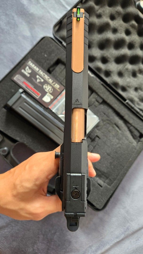 EMG Taran Tactical STI Combat Master 2011 JW3 (Category: Combat Sports) located in Calamba. Submitted by black2018 (Listing ID 1470557269, Image 3). Description: - Model: EMG Taran Tactical STI Combat Master 2011 Airsoft Pistol - Color/Finish: Black with bronze barrel and slide accents - Sights: Green fiber optic front sight and adjustable rear sight - Features: Textured grip with magwell - Condition: Clean, well-maintained, used less than 5 time