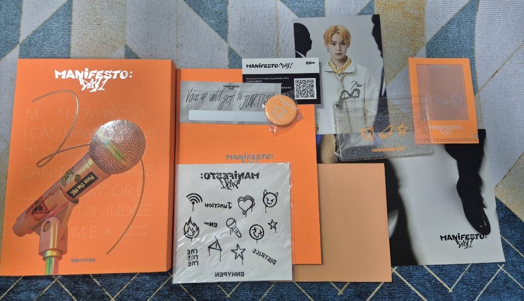 Enhypen Manifesto Day 1 (Standard M Version) (Category: K-Wave Merchandise) located in Bacoor. Submitted by rodJn (Listing ID 1470413966, Image 1). Description: Excl. PCSs Incl: Mini Poster Folded poster Photobook CD Message Card (Unscratched) Badge/Pin Tattoo Stickers POB: Card Holder POB: PC Shield.