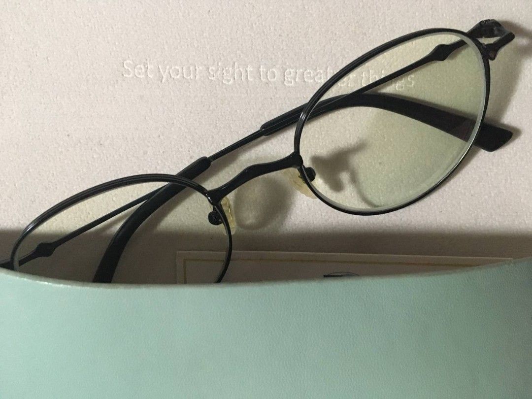EO Black Round Frame Glasses (Category: Sunglasses & Eyewear) located in Manila. Submitted by miax_1222 (Listing ID 1470401260, Image 2). Description: - Style: Classic black round frame with slim metal temples - Comfort: Lightweight design, ideal for everyday wear - Condition: Minor yellowing on the nose pads due to normal storage - Original case included but the case has flaws - Interested buyers must shoulder both lalamove booking and sf .