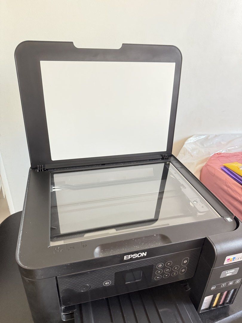 Epson EcoTank L4260 (Category: Printers, Scanners & Copiers) located in Manila. Submitted by ch11ng (Listing ID 1470359019, Image 3). Description: - Epson L4260 Ecotank Printer - Pigment Ink - Reason for Selling: No time to fix - Location: Bacoor, Cavite - Honest Issues: - Cover affected by acetone residue removal - Broken screw holder on scanner hinge - Missing line in blue ink on printouts .