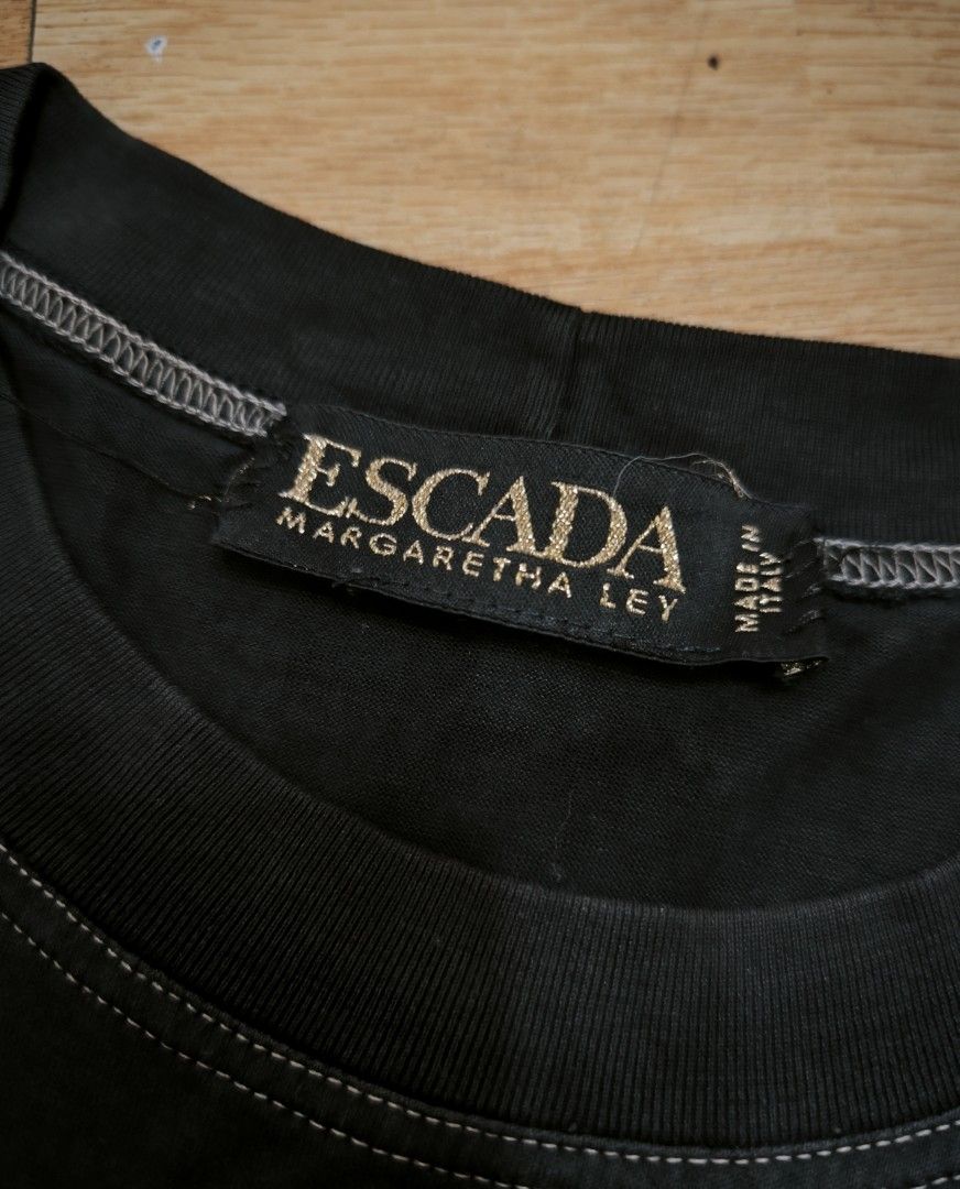 Escada women's shirt (Category: Shirts) located in Manila. Submitted by wearforce (Listing ID 1470491280, Image 2). Description: Escada women's shirt color: black fit: small color rate 9/10 in good condition 200 + sf.
