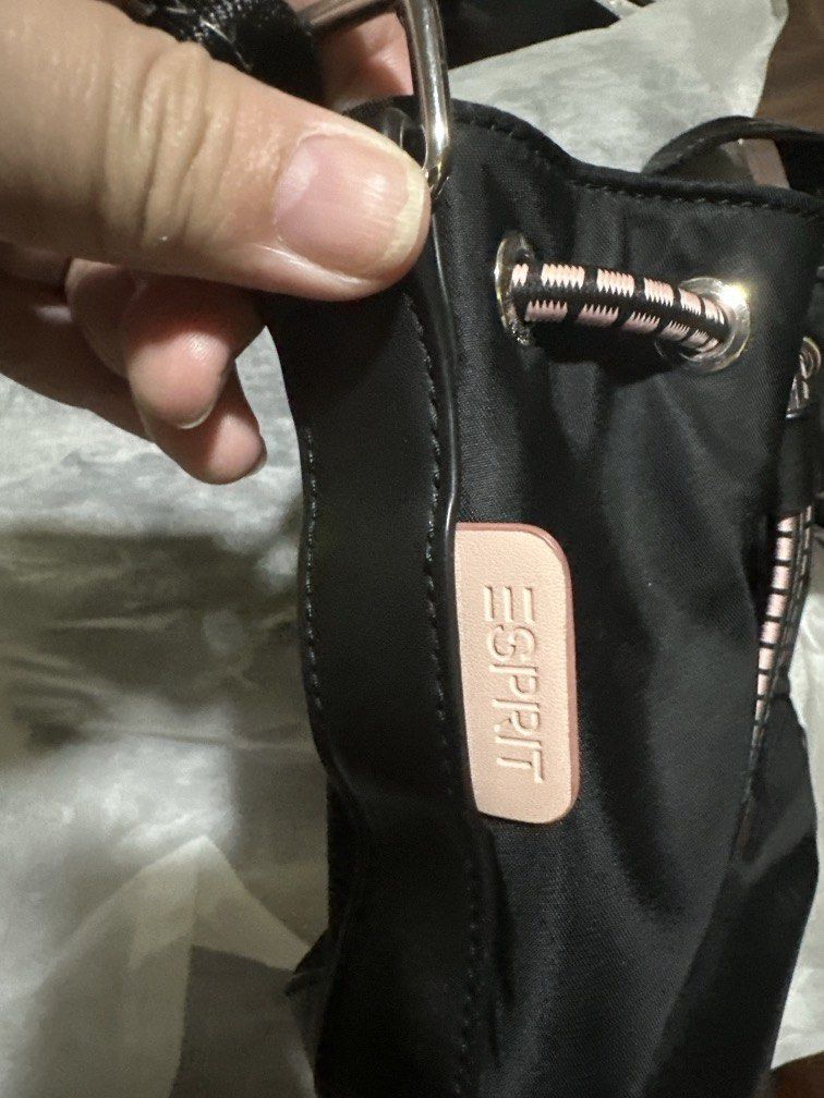 Esprit black sling bag (Category: Cross-body Bags) located in Marikina City. Submitted by prelovedmla (Listing ID 1470453830, Image 2). Description: Preloved sling Esprit bag. only flaw on the button strap (photo#3) the rest are flawless. Can fit upto an iphone pro plus small wallet. .