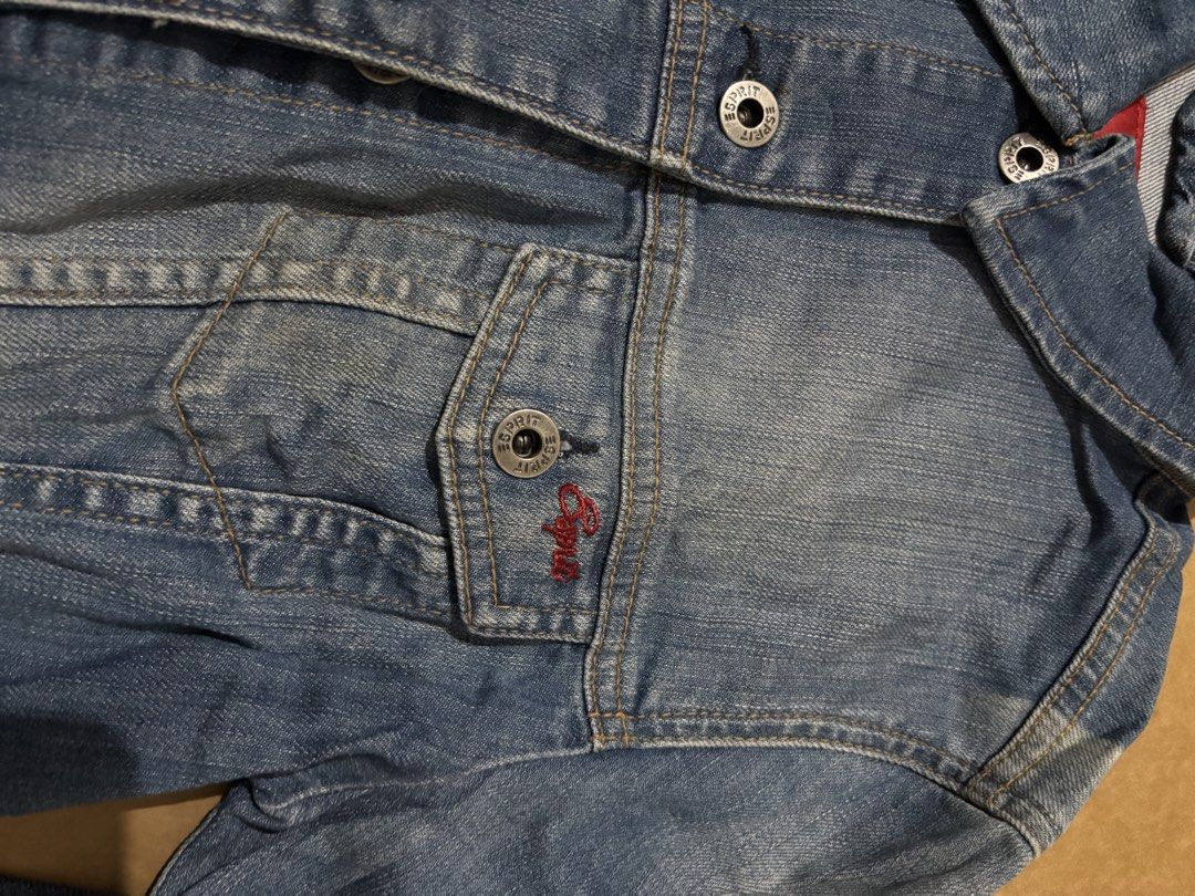 ESPRIT Blue Denim Jacket Size S (Category: Coats, Jackets and Outerwear) located in Manila. Submitted by aysshxx (Listing ID 1470421286, Image 2). Description: - Brand: ESPRIT - Style: Classic blue wash denim jacket with button-up front - Details: Two button-flap chest pockets (one with unique red embroidery) and branded metal buttons - Size: S (International sizing) - Origin: Made in Greece - Condition: Great casual layering piece, ready to wear