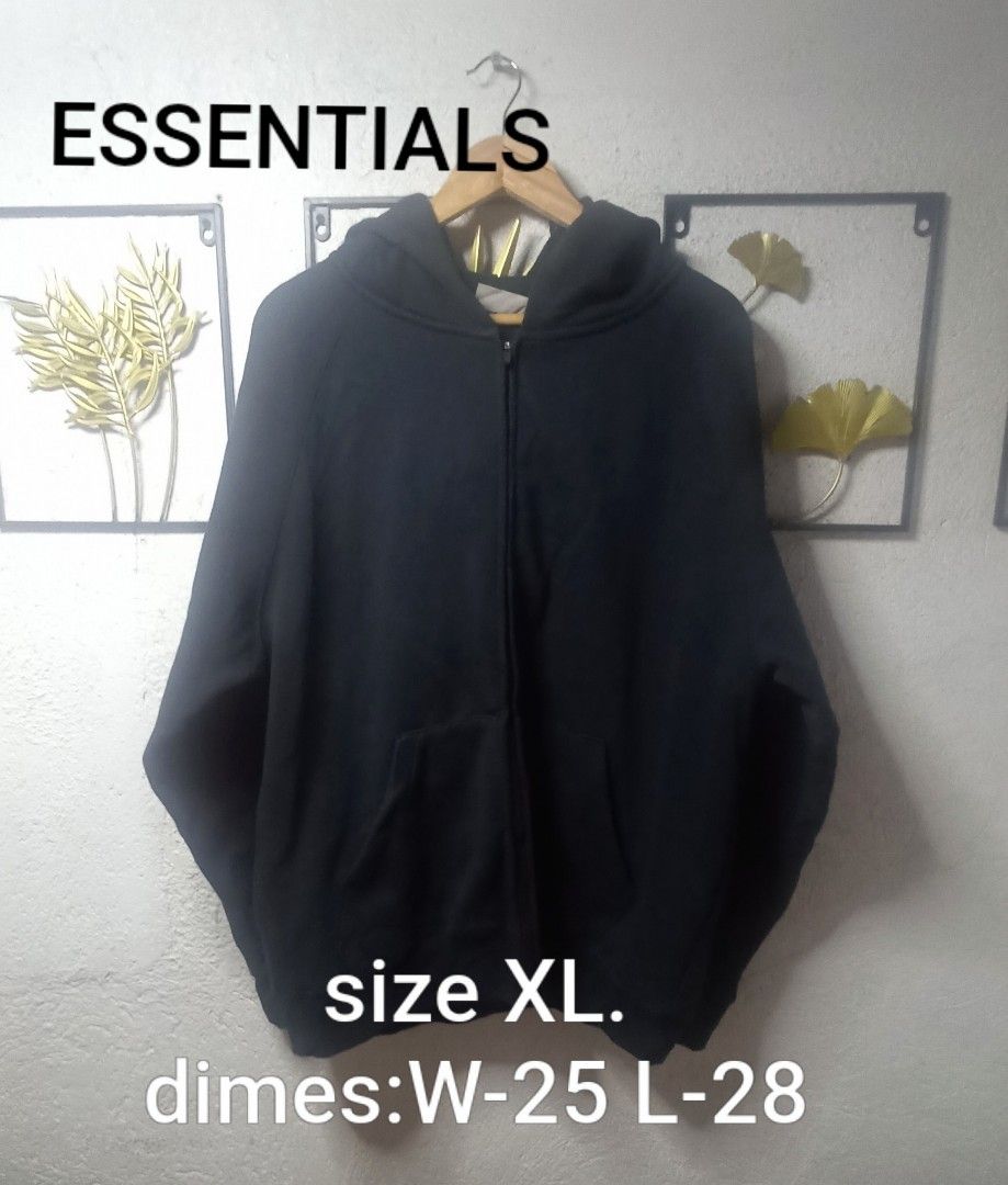 Essentials Hoodie (Category: Hoodies) located in Kawit. Submitted by deidzdzn (Listing ID 1470463930, Image 1). Description: Essentials Fear of God zip-up hoodie in black. Size XL. Measures 25 inches width by 28 inches length. Full front zip, hood with rubber brand patch on the back. Essentials logo printed on the left sleeve and back. ISSUE: NO WASH TAG OFF/LEGIT.
