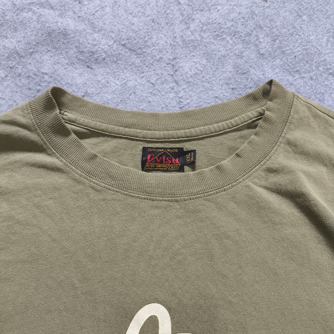 Evisu God Head Shirt (Category: Tshirts & Polo Shirts ) located in Manila. Submitted by shykes_26 (Listing ID 1470485939, Image 2). Description: Dimensions Width - 29 Length - 30 Size on tag - 2XL Issues - Penhole.