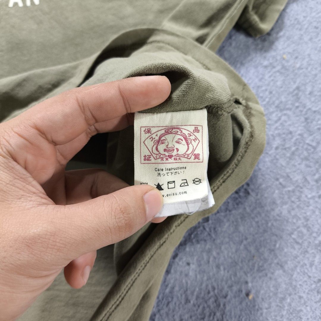 Evisu God Head Shirt (Category: Tshirts & Polo Shirts ) located in Manila. Submitted by shykes_26 (Listing ID 1470485939, Image 3). Description: Dimensions Width - 29 Length - 30 Size on tag - 2XL Issues - Penhole.