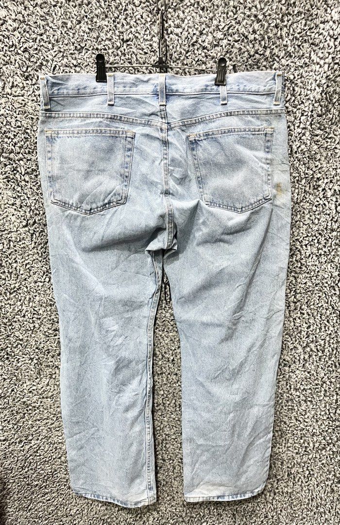 Faded Glory light wash denim jeans. | Size 38 (Category: Jeans) located in General Trias. Submitted by zrchustle.604 (Listing ID 1470458803, Image 3). Description: Faded Glory light wash denim jeans. These classic jeans feature a relaxed, straight-leg silhouette with a traditional five-pocket construction and standard button-and-zip closure. They showcase a worn, lived-in aesthetic with prominent natural fading across the front thighs and minor d