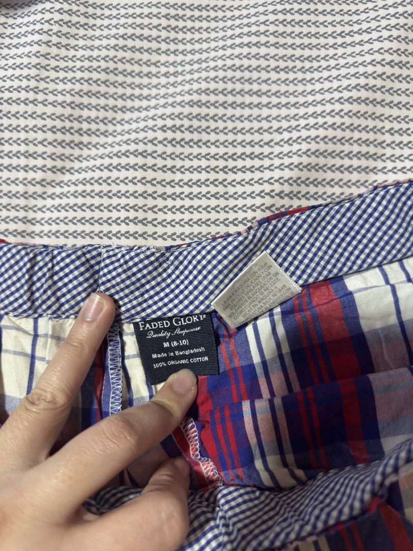 Faded Glory Plaid Pajama Shorts Medium (Category: Shorts) located in Santa Ana. Submitted by fatikilla (Listing ID 1470365076, Image 2). Description: - Brand: Faded Glory - Size: Medium (8-10) - Material: 100% soft, breathable organic cotton - Design: Red, white, and blue plaid with front button accent - Waistband: Elastic with adjustable blue ribbon drawstring - Care: Machine washable - Origin: Made in Bangladesh.