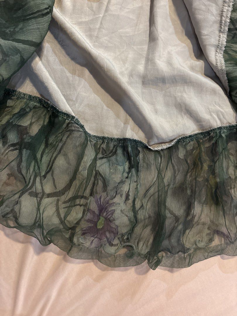 Fairy Ruffled Layered Skirt (Category: Skirts) located in Quezon City. Submitted by cmtom (Listing ID 1470368939, Image 3). Description: Loc: qc Superrr cute fairycore moss green layered skirt. Bought while thrifting in japan in 2024 but never worn (not really my style). Waistband is elastic and the skirt is lined on the inside Loose threads on the inner elastic stitching but otherwise great condition Best fits size XS-M, elastic is quite stretch