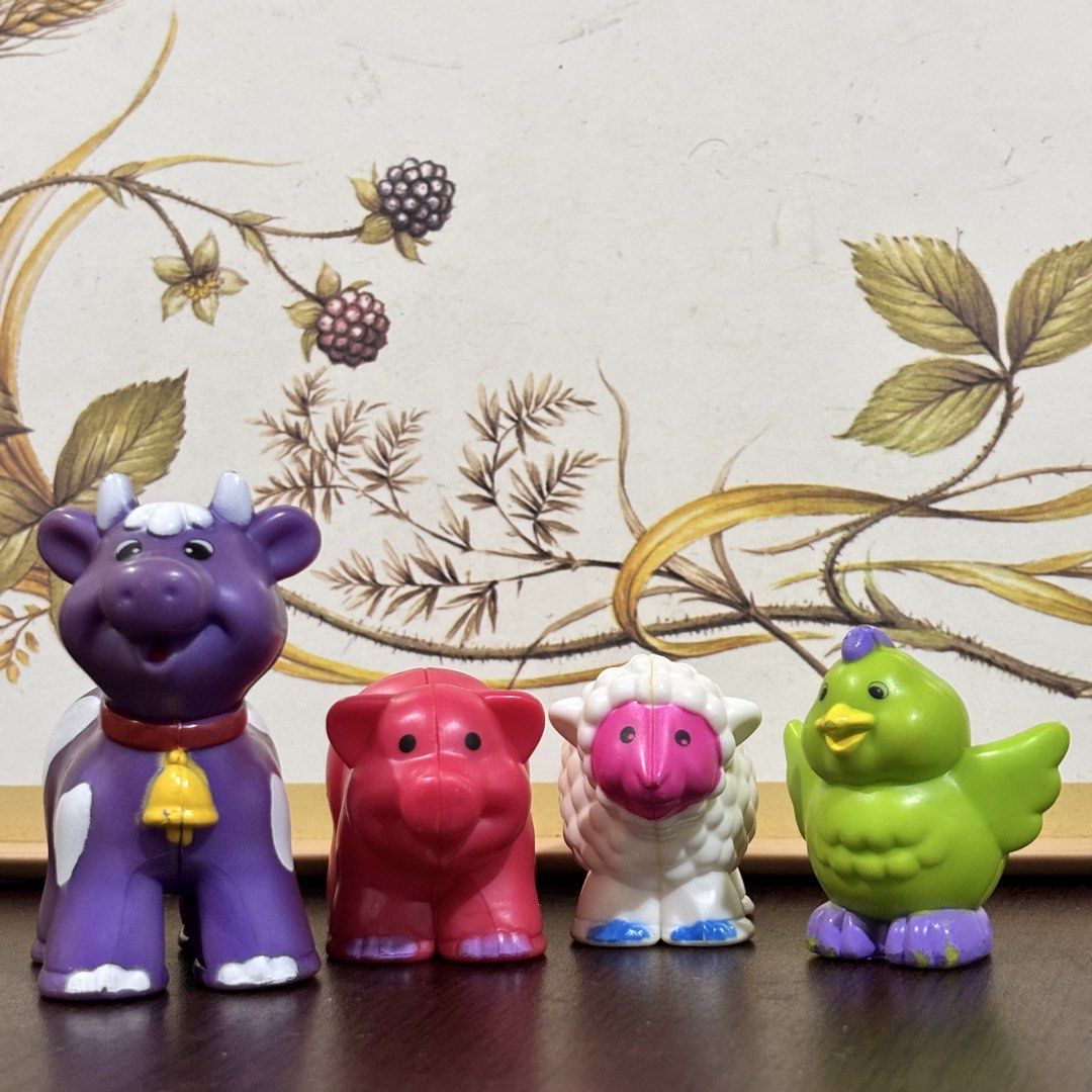 Farm Animal Figures Set (Category: Kids Toys) located in Taguig. Submitted by sunnyplaythingsph (Listing ID 1470513312, Image 1). Description: - Set of 4 classic Fisher-Price Little People farm animals - Includes purple cow, pink pig, white sheep, and green bird - Chunky plastic figures perfectly sized for toddlers - Clean and ready for playtime - Note: Minor paint wear on the purple cow and green bird's feet.