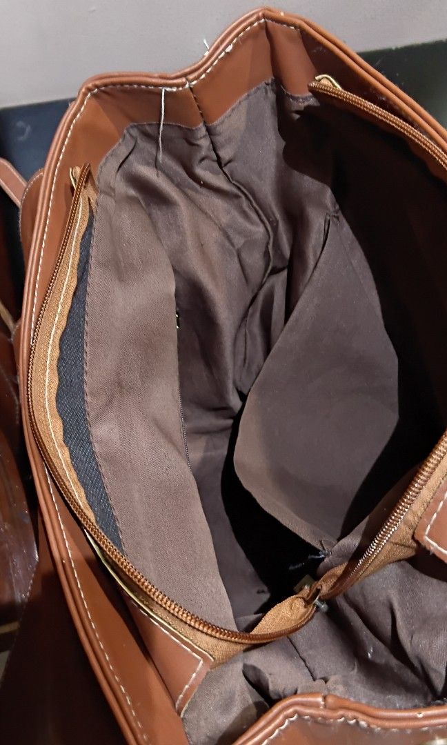 Faux Leather Backpack (Unbranded) (Category: Backpacks) located in Las Pinas. Submitted by randomstuff.ph (Listing ID 1470456442, Image 3). Description: FEATURES - Spacious - Various compartments for keeping small items CONDITION: Lightly used with slight flaws, as shown in the images YEAR BOUGHT: 2023.