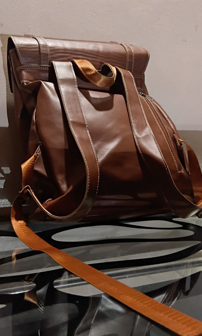 Faux Leather Backpack (Unbranded) (Category: Backpacks) located in Las Pinas. Submitted by randomstuff.ph (Listing ID 1470456442, Image 2). Description: FEATURES - Spacious - Various compartments for keeping small items CONDITION: Lightly used with slight flaws, as shown in the images YEAR BOUGHT: 2023.