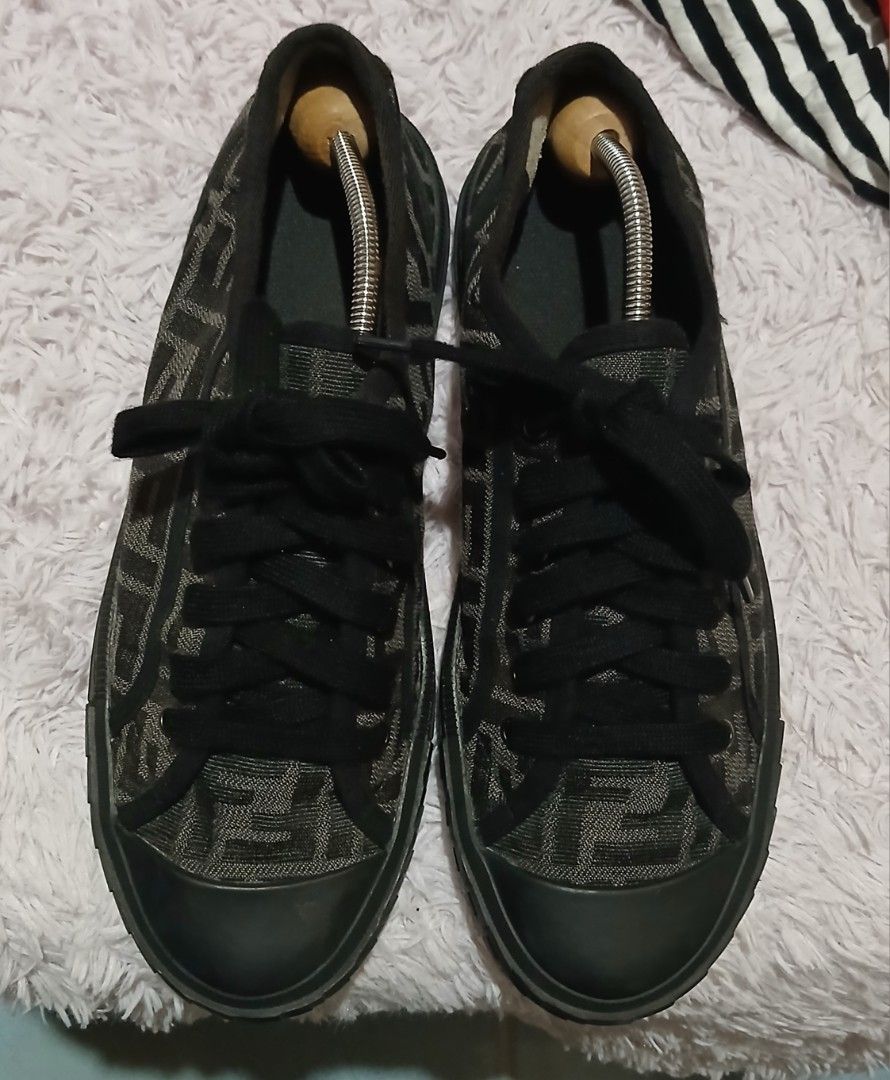 Fendi FF Zucca Print Canvas Low Top Sneakers (Category: Sneakers) located in Andop. Submitted by nzrhcollection (Listing ID 1470456879, Image 1). Description: - Brand: Fendi - Style: Low-top sneakers - Material: Black and brown FF Zucca print canvas with rubber toe caps - Details: Black laces, textured midsoles with embossed Fendi Roma branding on heels, and Italian-made gum soles - Condition: Visible signs of wear on the soles and inner heels - 