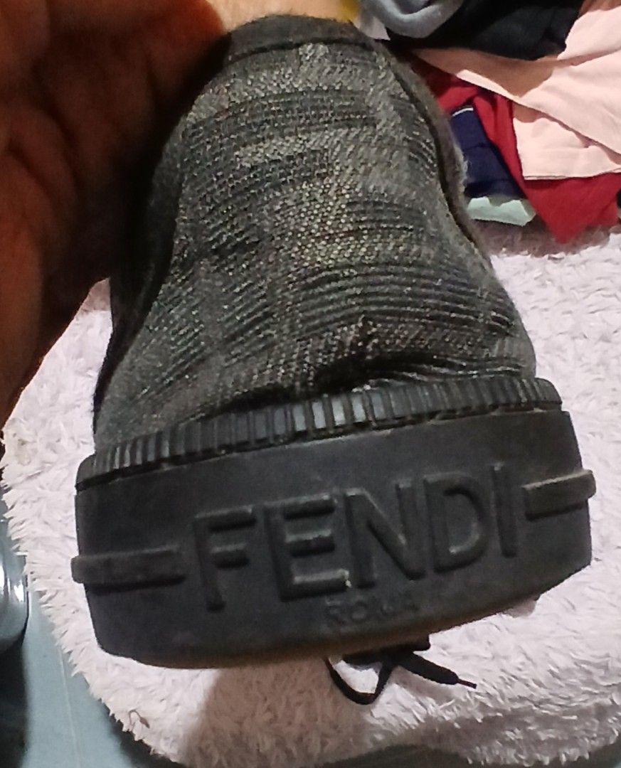 Fendi FF Zucca Print Canvas Low Top Sneakers (Category: Sneakers) located in Andop. Submitted by nzrhcollection (Listing ID 1470456879, Image 3). Description: - Brand: Fendi - Style: Low-top sneakers - Material: Black and brown FF Zucca print canvas with rubber toe caps - Details: Black laces, textured midsoles with embossed Fendi Roma branding on heels, and Italian-made gum soles - Condition: Visible signs of wear on the soles and inner heels - 
