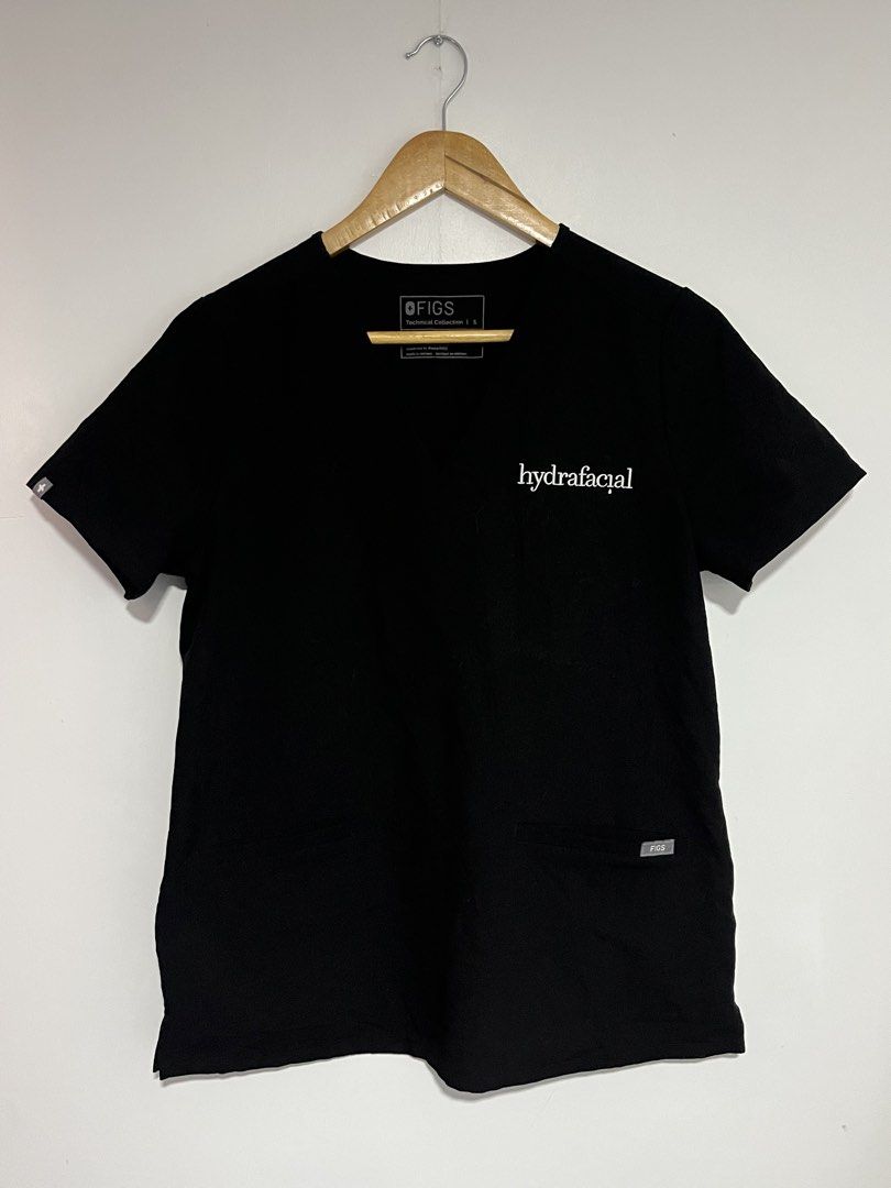 FIGS Technical Collection Black Scrub Top with HydraFacial Embroidery (Category: Activewear) located in Dasmarinas. Submitted by thriftedbygii (Listing ID 1470354255, Image 2). Description: - Brand/Model: Figs Technical Collection Scrub Top - Size: Small - Color: Black with White Hydrafacial chest embroidery - Design: Classic V-neck, short sleeves, and convenient front pockets - Material & Care: Comfortable fabric that is easy to wash - Origin: M