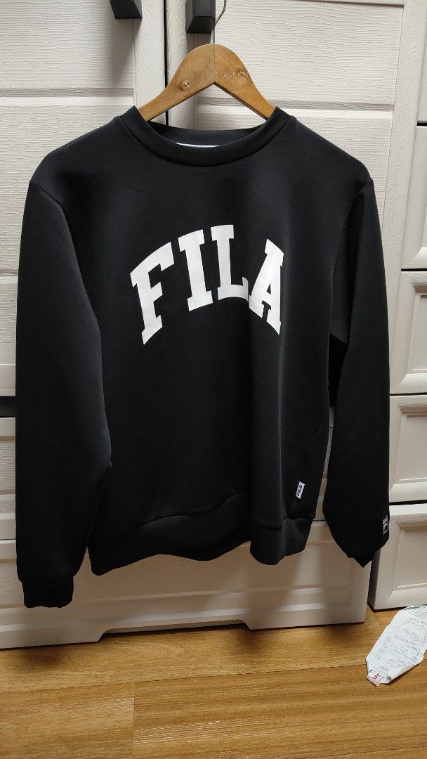 FILA Black Sweatshirt with White Logo (Category: Coats, Jackets and Outerwear) located in Manila. Submitted by nel0928 (Listing ID 1470494160, Image 1). Description: - Brand: FILA - Color: Classic Black with large white arched logo - Design: Long sleeves, ribbed cuffs and hem, crew neckline - Details: Features small branded tags on the lower left side and sleeve cuff - Style: Great for casual wear or cooler weather - Shipping: Ships fast from the