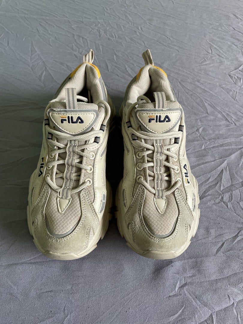 Fila Chunky Sneakers Beige Size US 6.5 (Category: Sneakers) located in Cagayan de Oro. Submitted by jekdels05 (Listing ID 1470351656, Image 2). Description: - Brand: Fila chunky dad shoes - Colorway: Cream and beige with yellow heel tab and navy outsole striping - Size: US 6.5 / EUR 39 / UK 5.5 / 250mm - Features: Thick sculpted rubber sole, reflective side details, breathable mesh panels, and original laces - Condition: Minor signs of wear on th