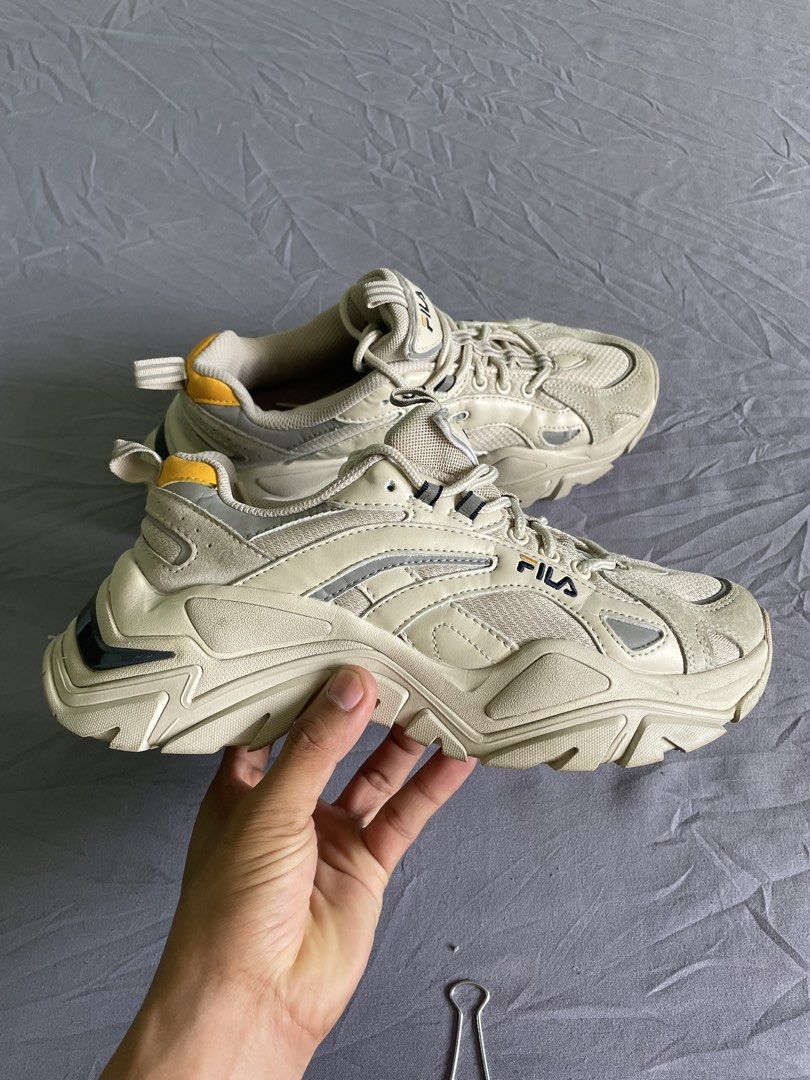 Fila Chunky Sneakers Beige Size US 6.5 (Category: Sneakers) located in Cagayan de Oro. Submitted by jekdels05 (Listing ID 1470351656, Image 1). Description: - Brand: Fila chunky dad shoes - Colorway: Cream and beige with yellow heel tab and navy outsole striping - Size: US 6.5 / EUR 39 / UK 5.5 / 250mm - Features: Thick sculpted rubber sole, reflective side details, breathable mesh panels, and original laces - Condition: Minor signs of wear on th