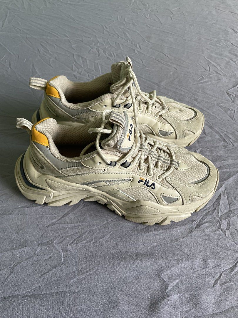Fila Chunky Sneakers Beige Size US 6.5 (Category: Sneakers) located in Cagayan de Oro. Submitted by jekdels05 (Listing ID 1470351656, Image 3). Description: - Brand: Fila chunky dad shoes - Colorway: Cream and beige with yellow heel tab and navy outsole striping - Size: US 6.5 / EUR 39 / UK 5.5 / 250mm - Features: Thick sculpted rubber sole, reflective side details, breathable mesh panels, and original laces - Condition: Minor signs of wear on th