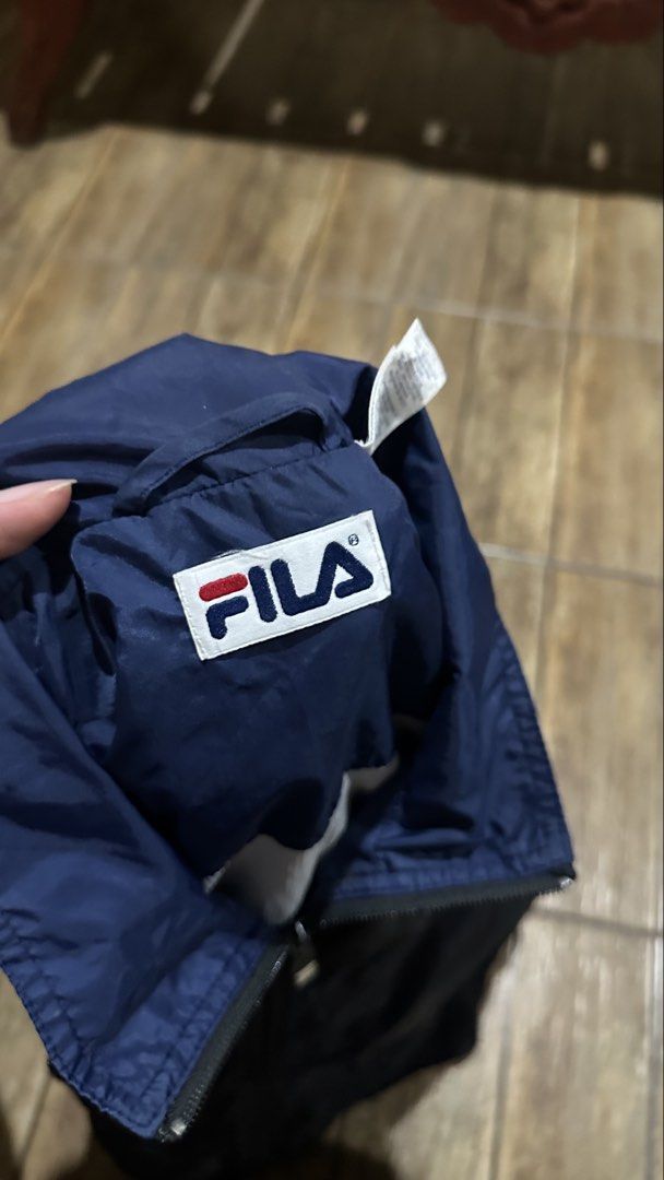 FILA WINDBREAKER (Category: Coats, Jackets and Outerwear) located in Manila. Submitted by urban-vintage_2 (Listing ID 1470531189, Image 2). Description: ISSUE: SEE THE PICS FOR ISSUE (NEED WASH) MOP :GCASH (NO COD) SHIP VIA: LALAMOVE & J&T LOCATION: PASIG CITY LENGTH: 28 WIDTH :24 .