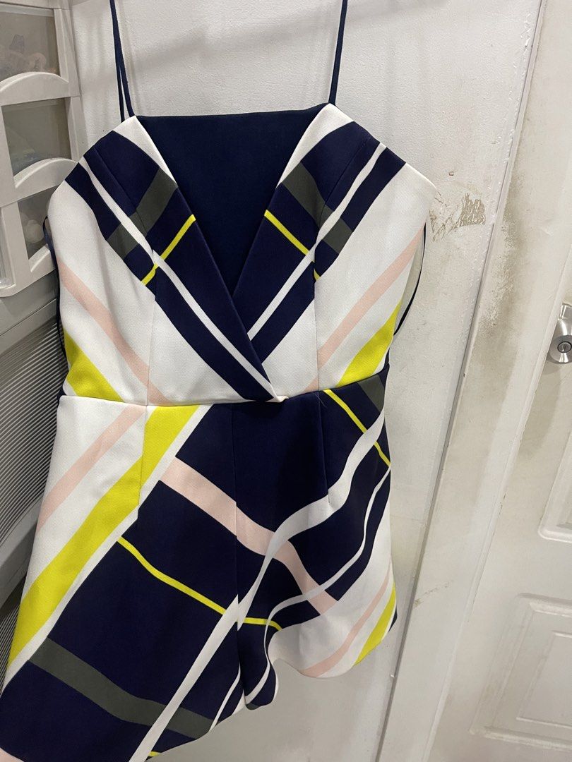 Finders Keepers Multi-Color Geometric Romper Size XS (Category: Rompers) located in Manila. Submitted by mariel1124 (Listing ID 1470524562, Image 2). Description: - Brand: Finders Keepers - Size: XS - Pattern: Navy blue, white, yellow, and pink diagonal stripes - Design: Spaghetti straps, V-neckline wrap front, structured fitted waist, and relaxed shorts - Closure: Back zipper with concealed zip - Details: Clean inside lining, great for warm weat