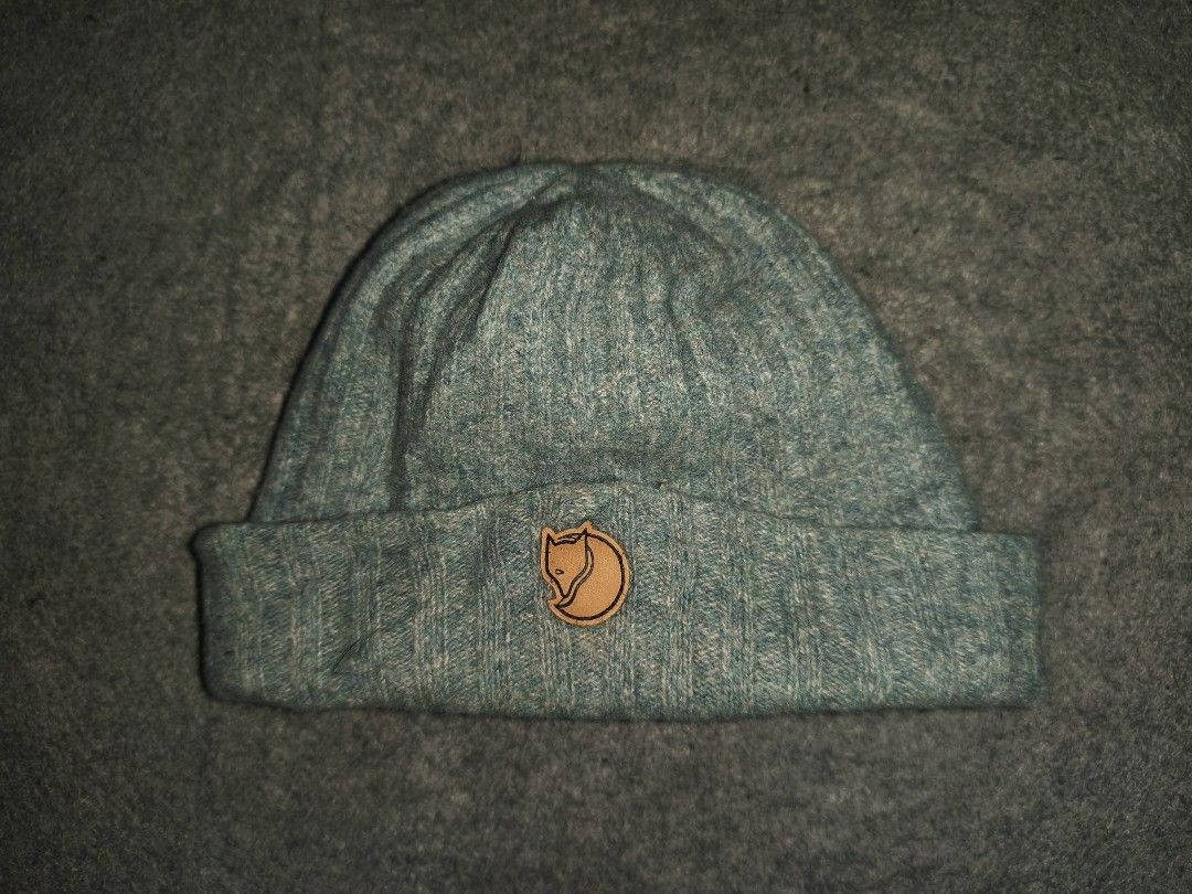 Fjallraven Byron Hat Blue (Category: Beanies) located in Cagayan de Oro. Submitted by elijah350below (Listing ID 1470479727, Image 3). Description: - Authentic Fjallraven Byron Hat (Model: 77388) - Color: Heathered blue-green - Condition: Clean with tags attached inside - Size: One size fits all - Details: All-over rib-knit texture, front leather fox logo patch, and signature side Swedish flag tab payment: Gcash, maribank & LBP courier: J&T color