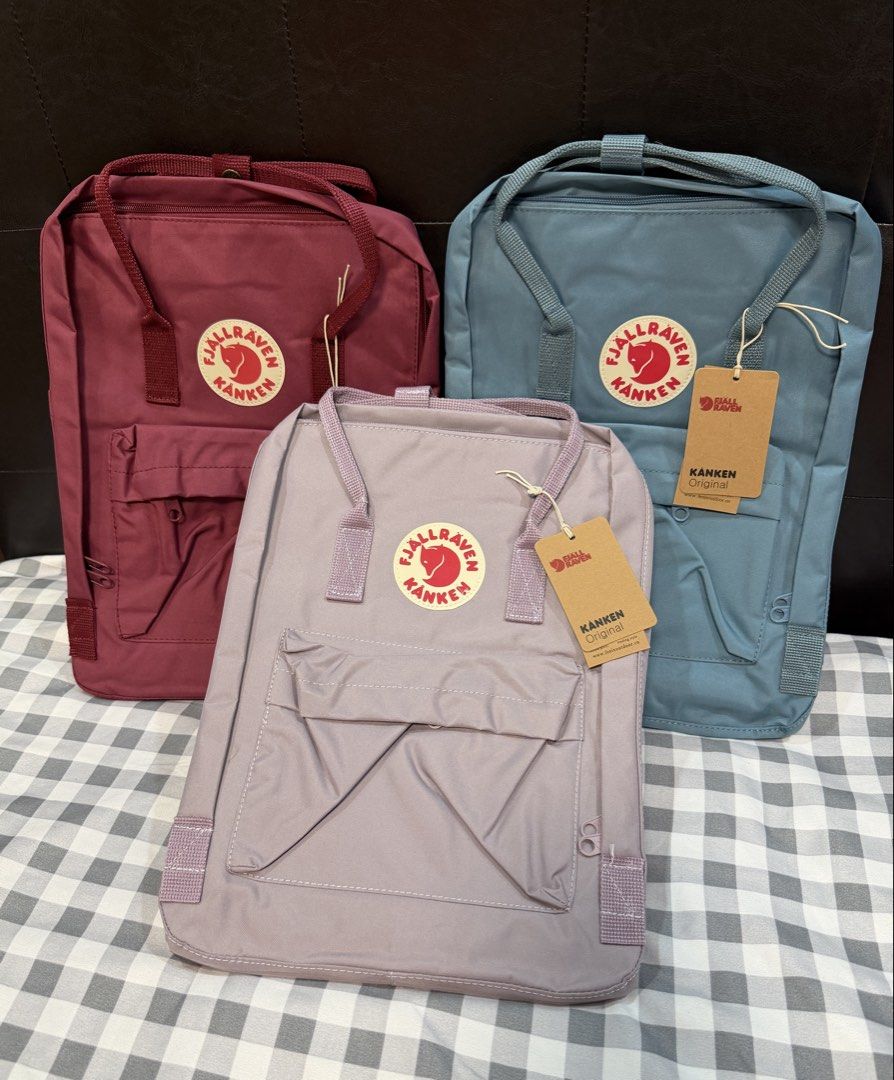 Fjallraven Kanken Backpacks (Category: Backpacks) located in Makati City. Submitted by gigidvd (Listing ID 1470446807, Image 1). Description: - Color: Red, Blue, Purple - Brand new with a reflective logo - Classic rectangular shape with dual top handles.