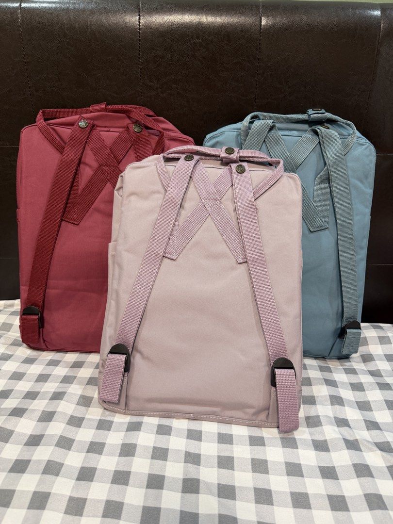 Fjallraven Kanken Backpacks (Category: Backpacks) located in Makati City. Submitted by gigidvd (Listing ID 1470446807, Image 2). Description: - Color: Red, Blue, Purple - Brand new with a reflective logo - Classic rectangular shape with dual top handles.