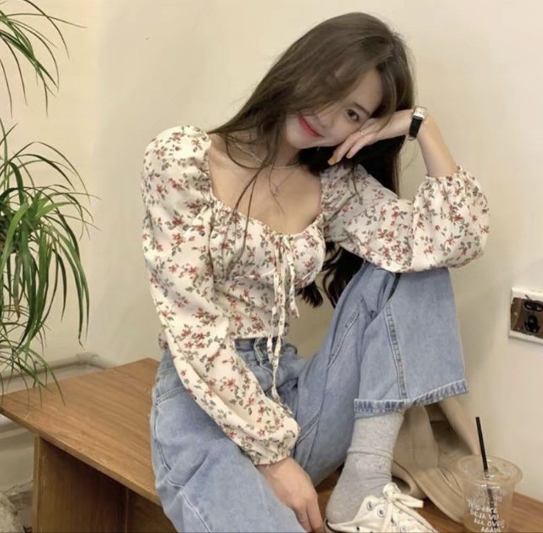 Floral Square Neck Long Sleeve Blouse (Category: Longsleeves) located in Baguio. Submitted by declutterbycys (Listing ID 1470385295, Image 1). Description: - Color/Pattern: White with tiny red floral print - Fit: Slim fit, looks great with denim jeans - Neckline: Square neckline with a cute tie-string detail - Sleeves: Long puffy sleeves with elastic cuffs - Condition: Excellent/Brand New.